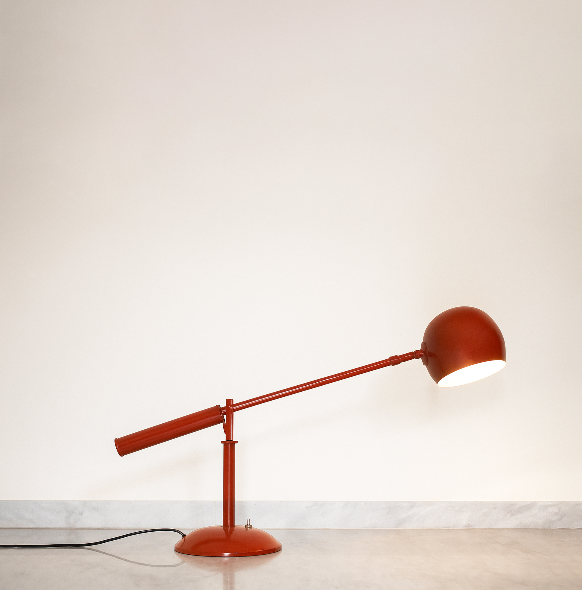 The Art of Lighting: Discover the See-Saw Table Lamp red