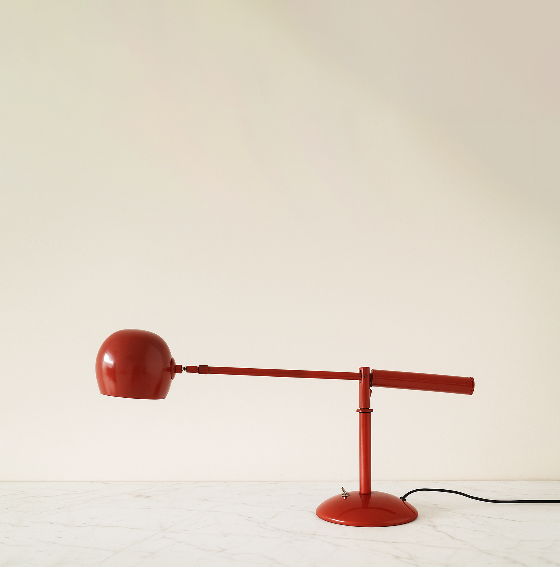 The Art of Lighting: Discover the See-Saw Table Lamp red