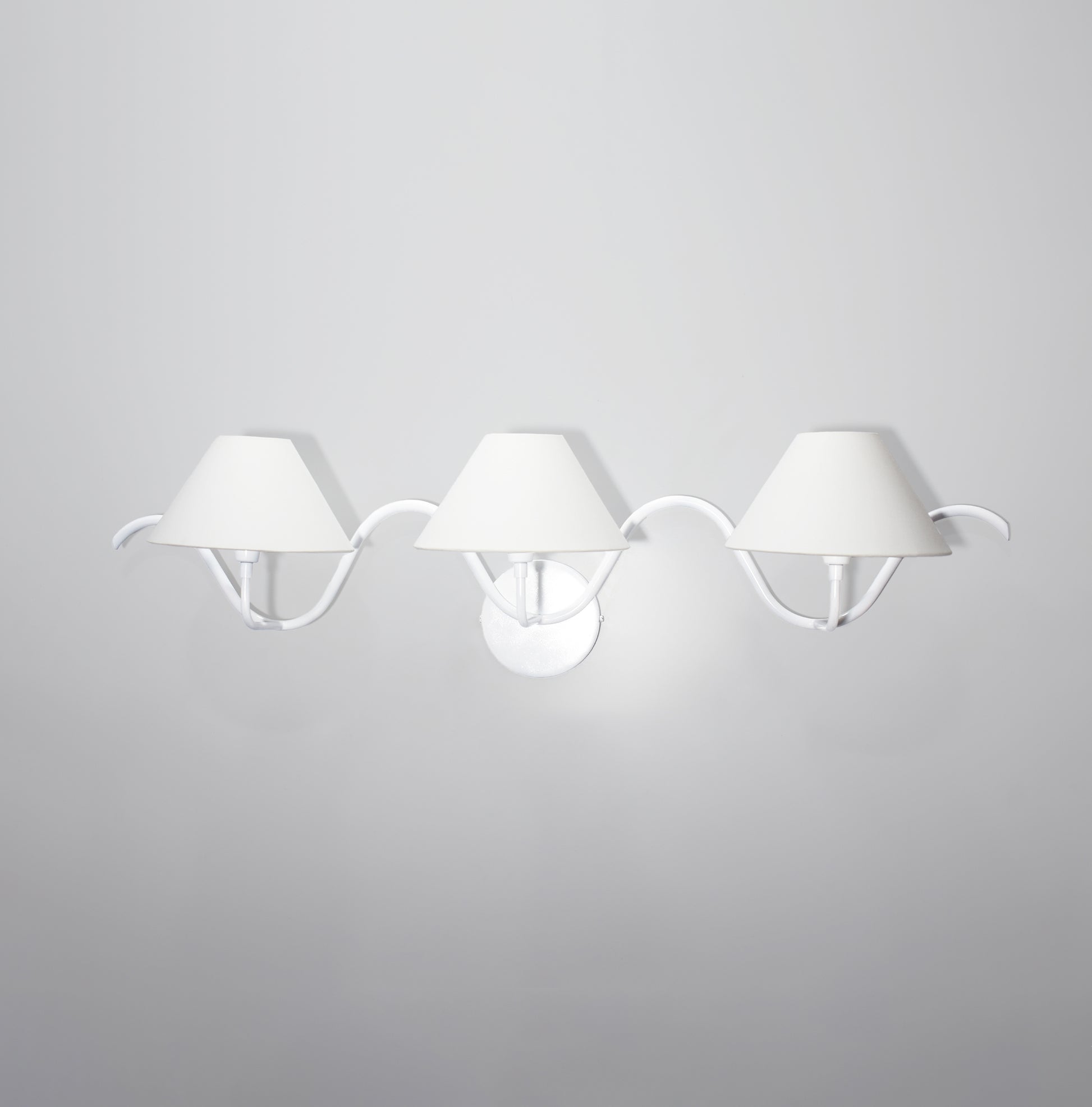 The Allure of Minimalism: Three White Wall Lamps