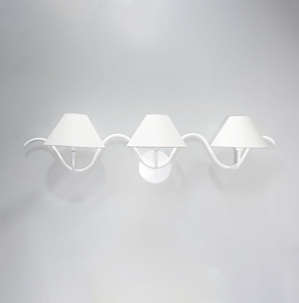 The Allure of Minimalism: Three White Wall Lamps