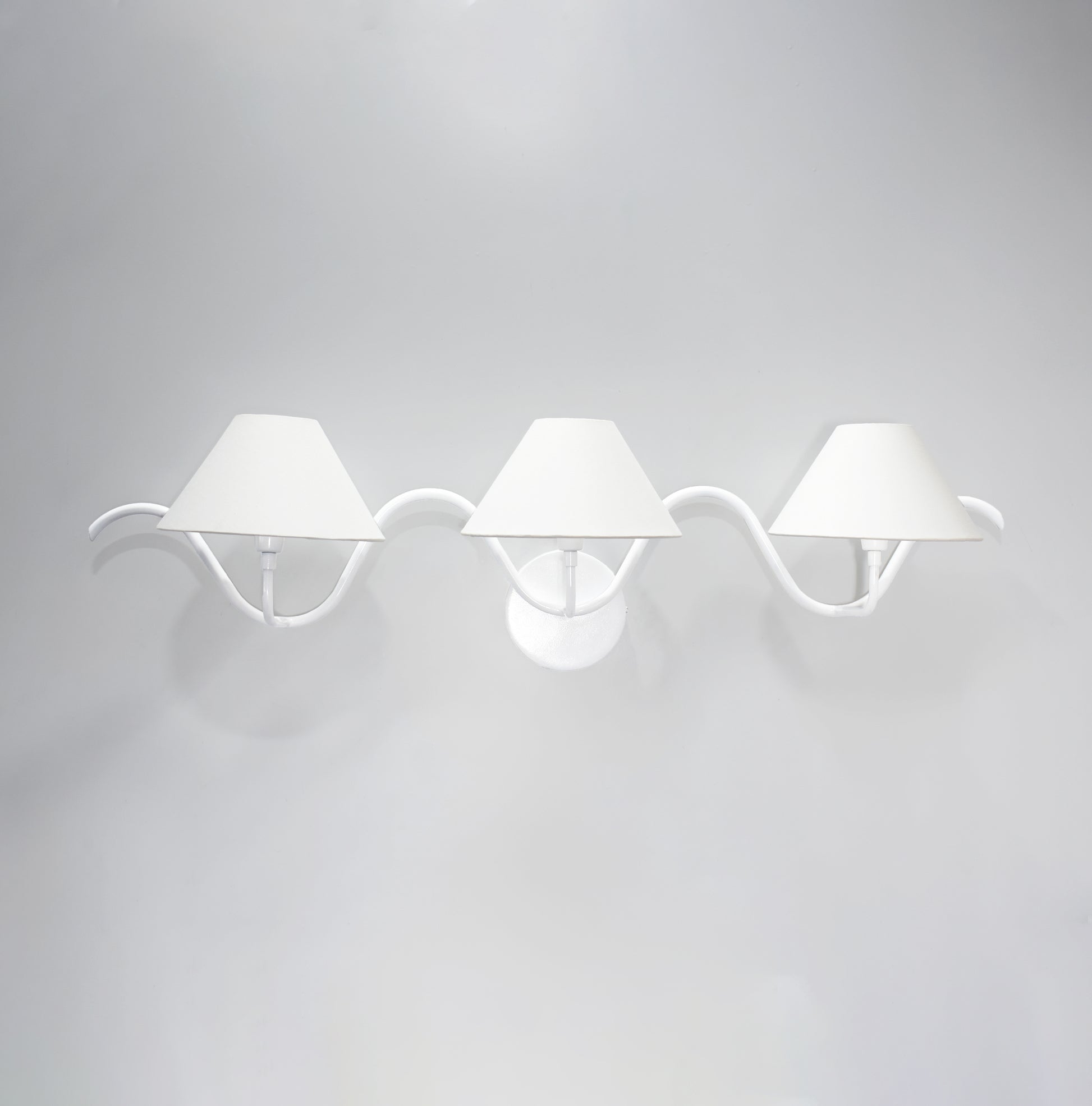 The Allure of Minimalism: Three White Wall Lamps