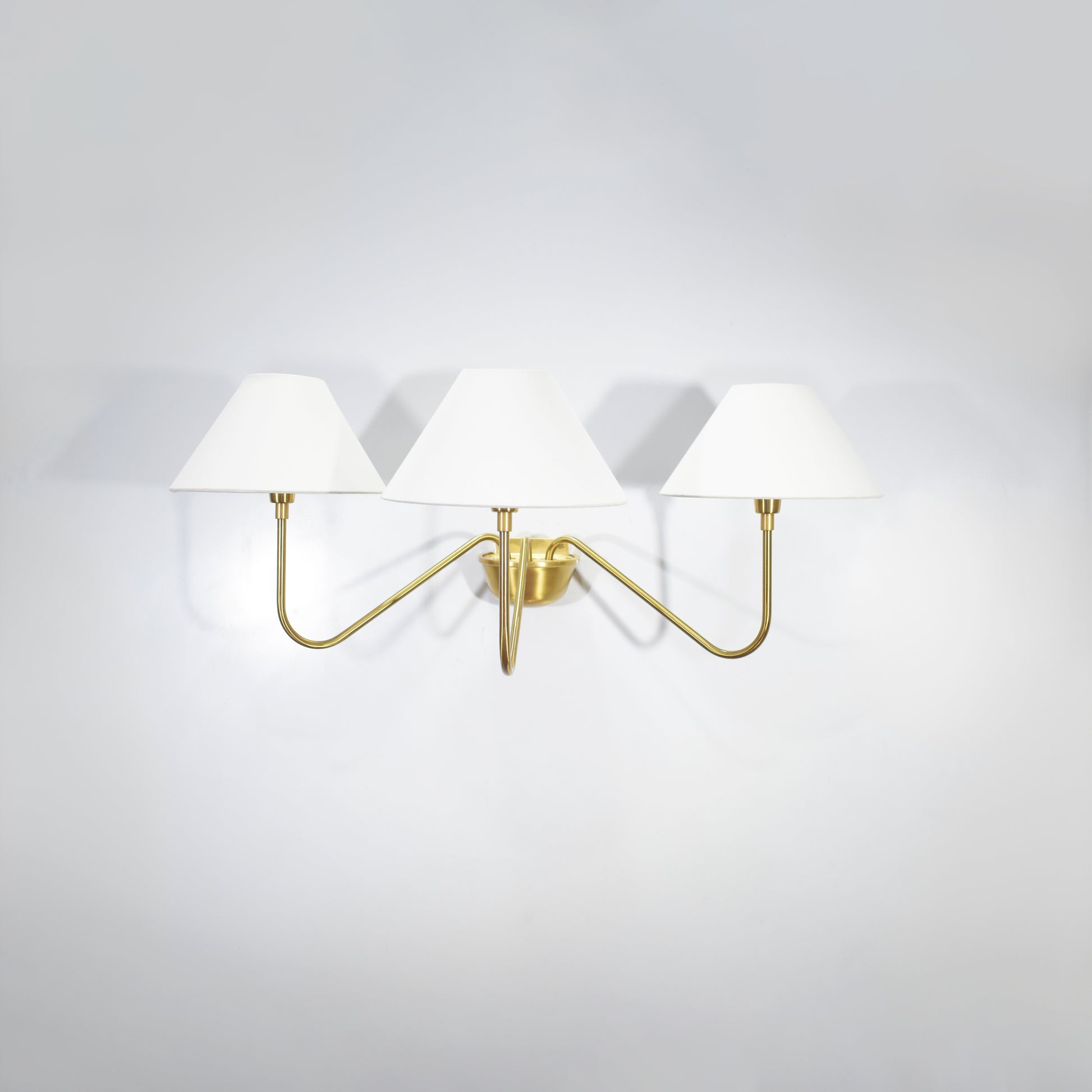 Introducing our modern gold 3 Lights Wall Lamp, a stunning addition to any space.
