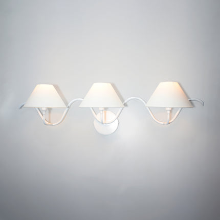 The Allure of Minimalism: Three White Wall Lamps