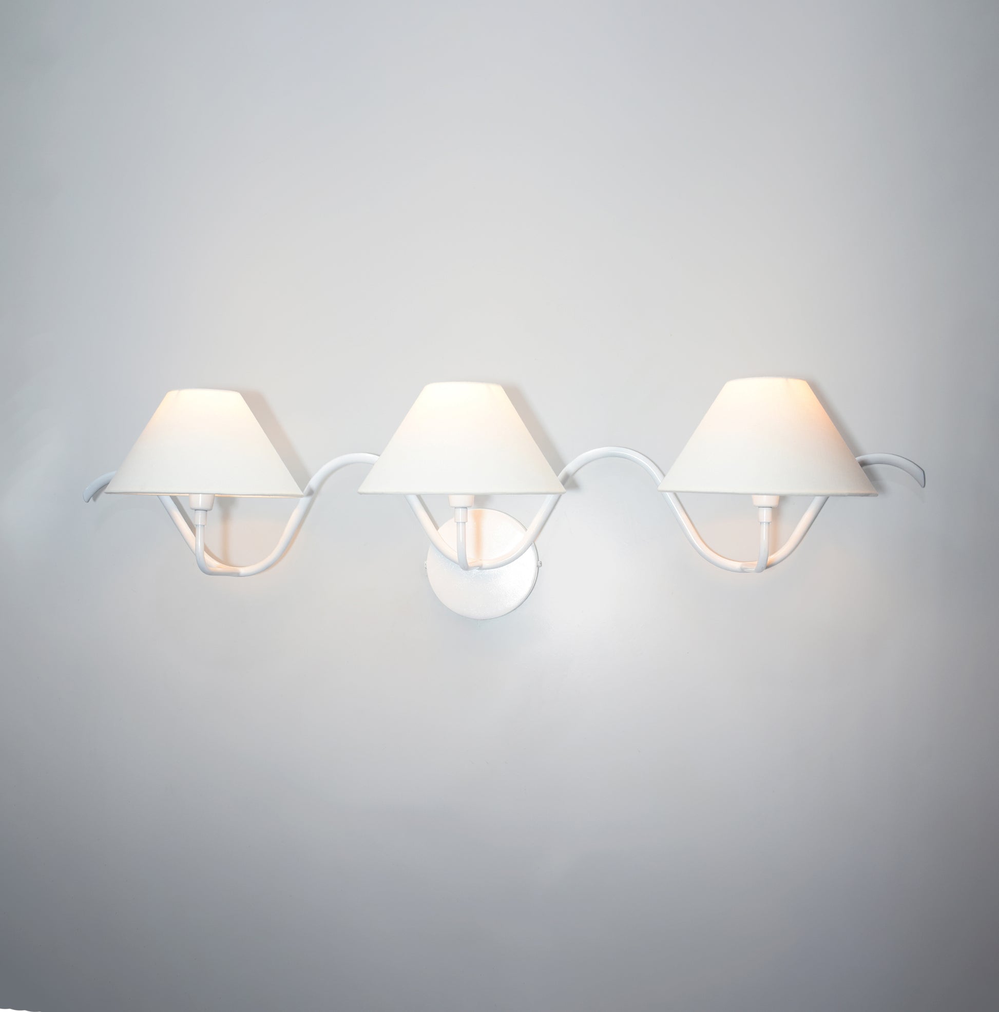 The Allure of Minimalism: Three White Wall Lamps