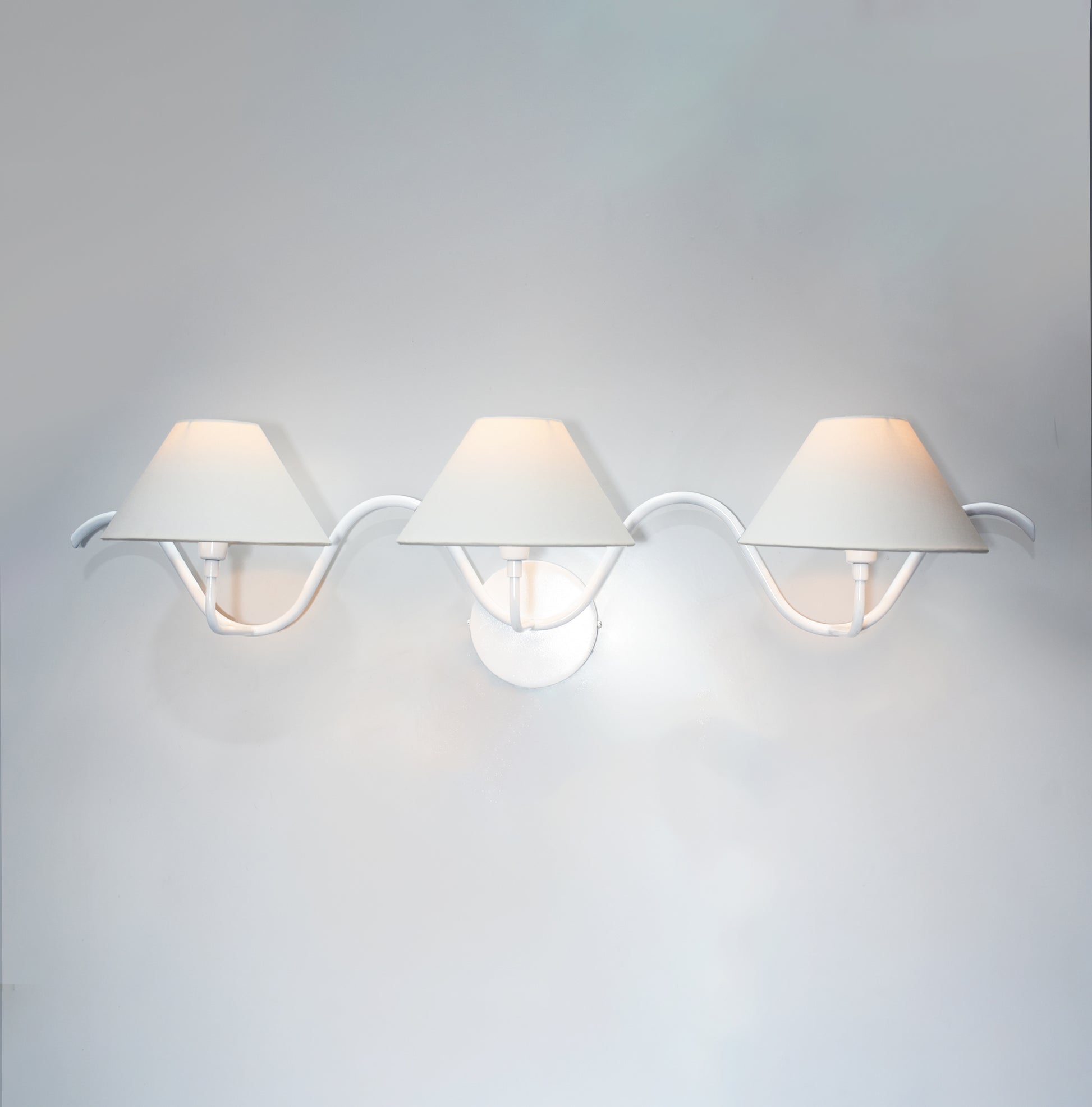 The Allure of Minimalism: Three White Wall Lamps