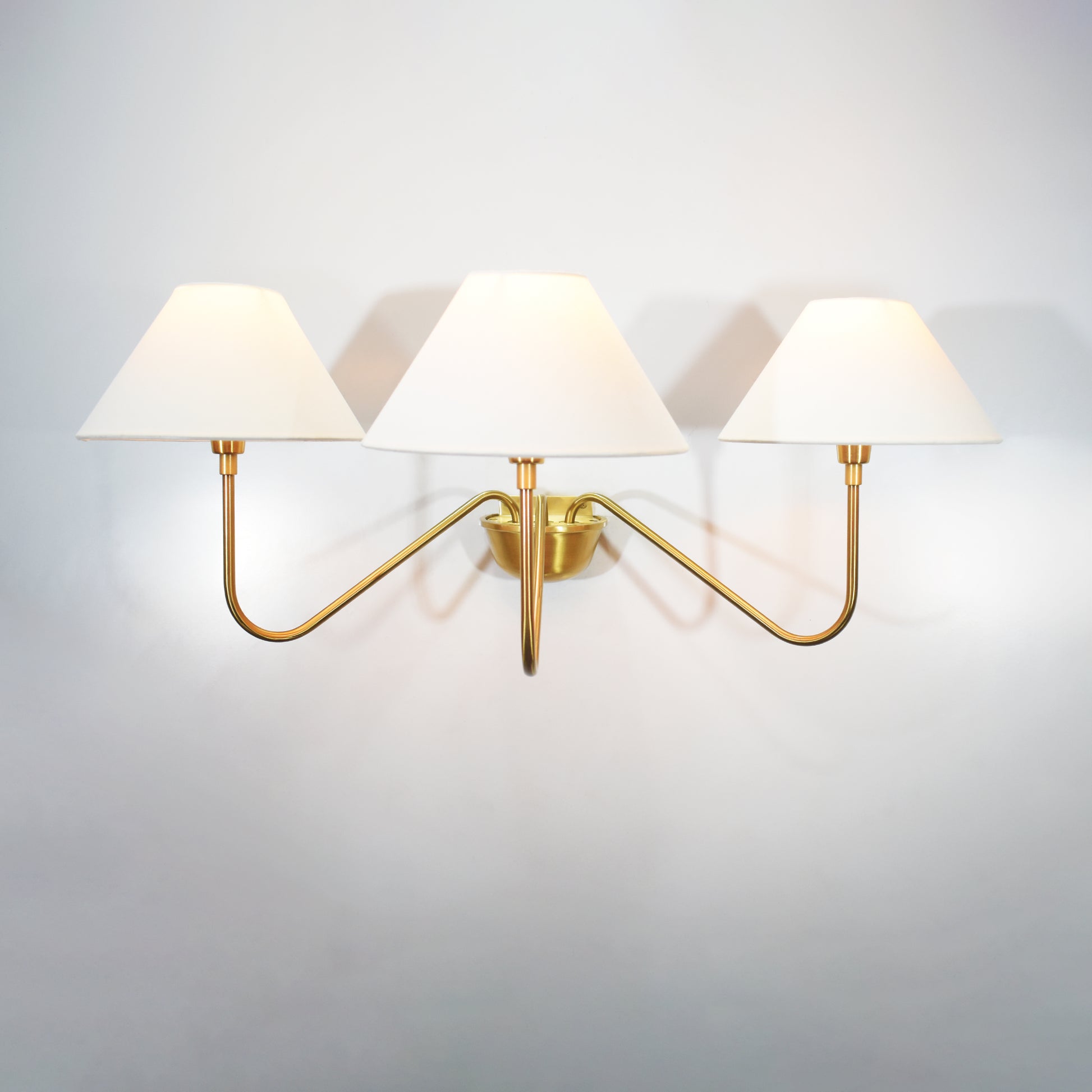 Introducing our modern gold 3 Lights Wall Lamp, a stunning addition to any space.