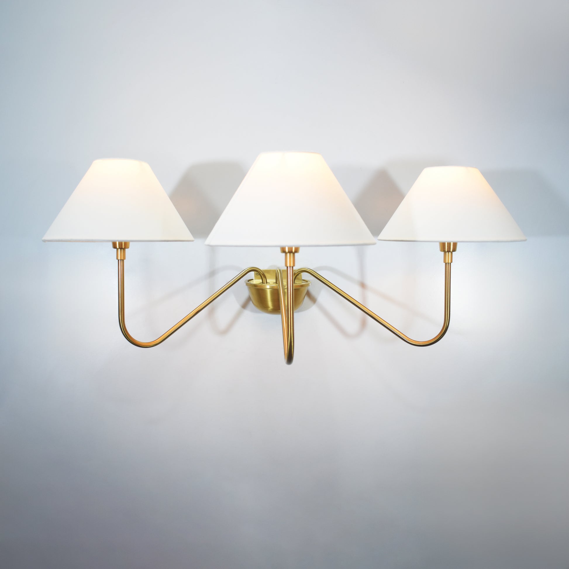 Introducing our modern gold 3 Lights Wall Lamp, a stunning addition to any space.