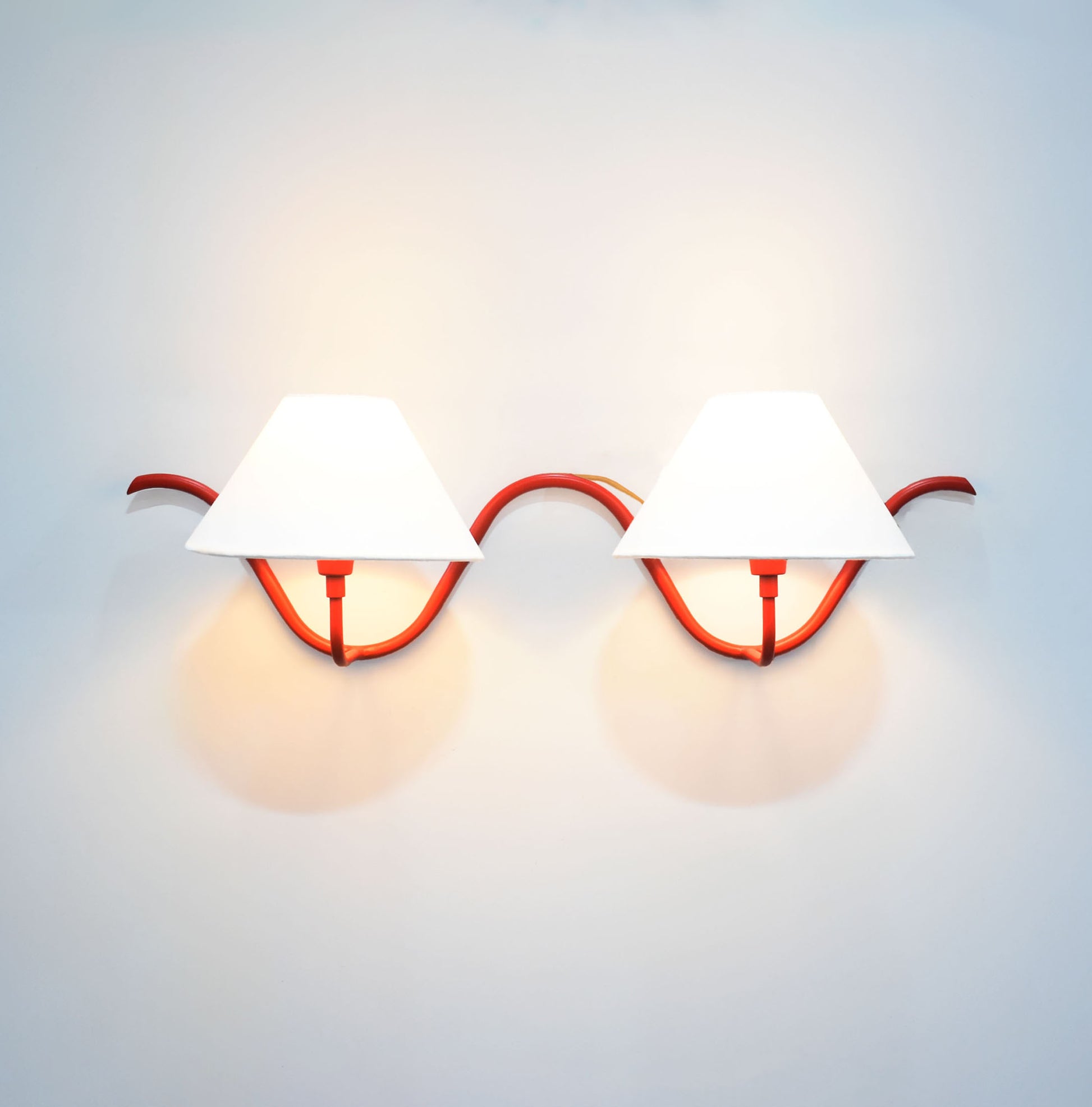 Red Wall Lamps Featuring Dual Bulbs