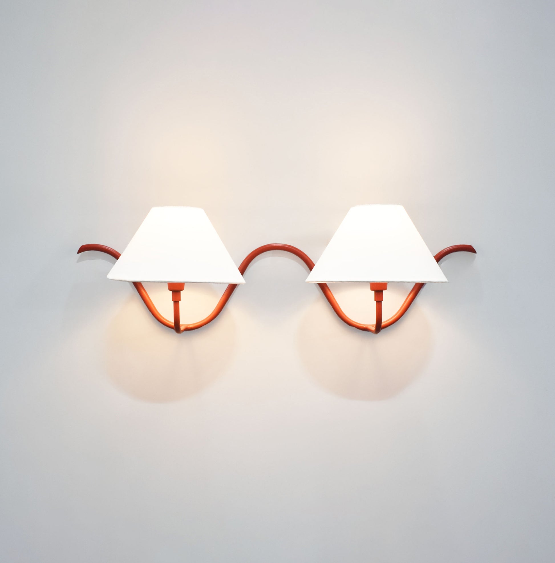 Red Wall Lamps Featuring Dual Bulbs